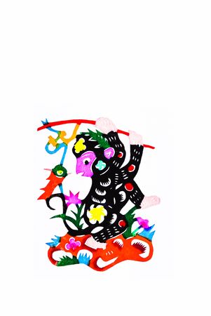 monkey,This is a Chinese paper-cut, reflecting the animal a happy life scenarios.の写真素材