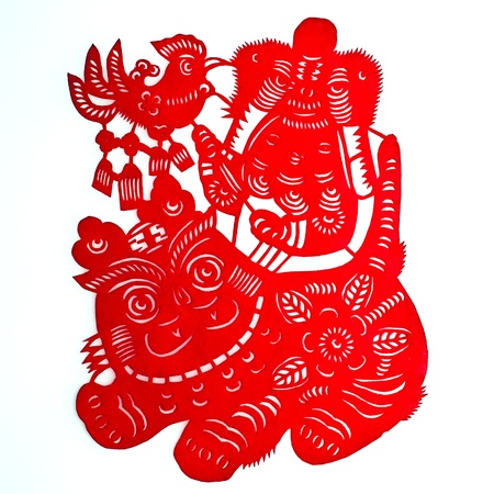 Child in Tiger-hat Playing with Tiger.A traditional Chinese paper cutting of a chubby child in tiger-hat, holding a cock toy and playing with a big tiger.の写真素材