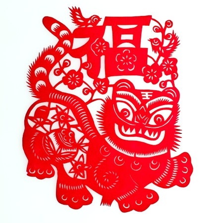 Tiger and Good Fortune.A traditional Chinese paper cutting of a tiger with a character of âgood fortuneâ above its head, and two magpies around, standing for âhappinessâ.の写真素材
