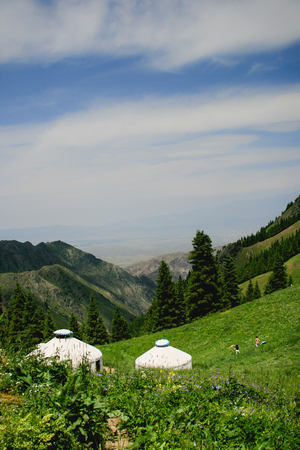 Urumqi Grassland with Mongolian yurtsの写真素材
