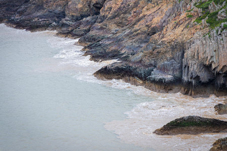 Rocky seashore with waves crashing on the rocks. Seascapeの写真素材