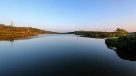 Landscape with lake and blue sky at sunset. Nature composition.の写真素材