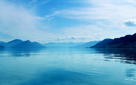 Lake and mountain scenery in the backgroundの写真素材