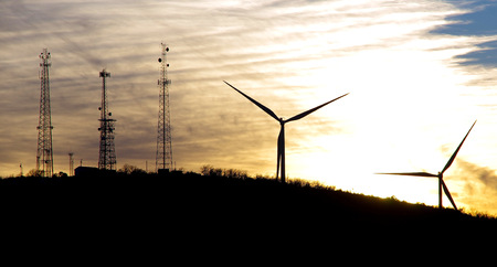 Windmills at sunset in the Arbuckle Mountains Oklahomaの写真素材