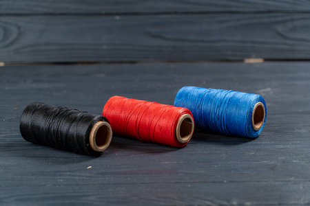thread coils black red and blue