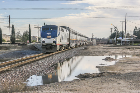 Amtrak Train arriving at Modesto Amtrack Station, Modesto CA. USA.のeditorial素材