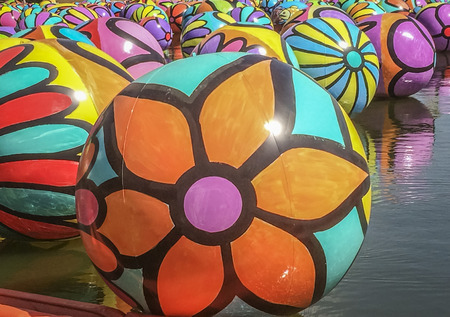 October62015 - Colorful aquatics ball at Mcarthur Park, Los Angeles CA. USA.Thousands hand-painted, colorful inflatable balls going with the wind at McArthur Park lake, Portraits of Hope, an LA-based arts nonprofit organized the project with the assistancのeditorial素材