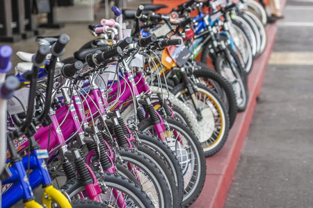 Bycycles in line, store front, sport.