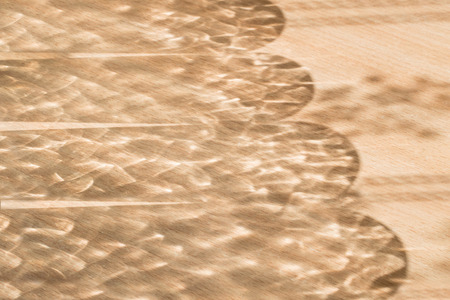 Sunlight and shadows form an interesting pattern on the table
