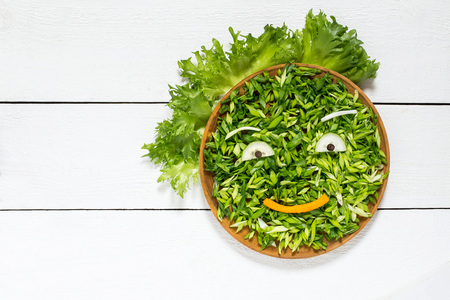 The concept of ecology, healthy food, preventing the spring avitaminosis - fresh green vegetables in...