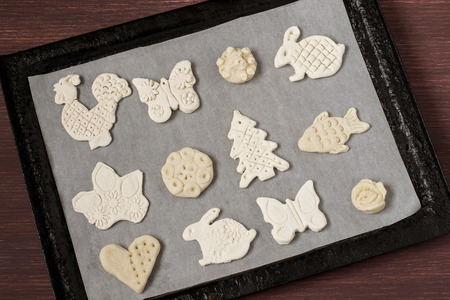 Making toys for Christmas decorations from salt dough with your own hands. Children's art project....
