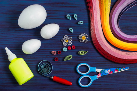 Homemade decor Easter eggs in the technique of quilling. DIY concept. Step-by-step photo...