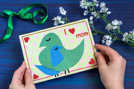 Making a greeting card for Mother's Day. Children's art project. DIY concept. Step-by-step photo...