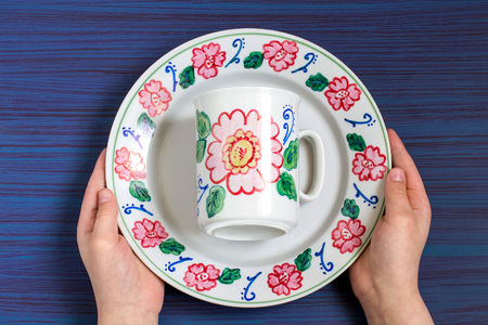 Handmade colorful painting on crockery markers for ceramics. Children's art project, craft for children. DIY concept. Step-by-step photo instructions. Step 7. Final resultの写真素材