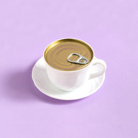 Cup of coffee like tincan on pastel purple background. Minimal style. Creative idea, imagination and fantasy. Original food concept: food and storageの写真素材