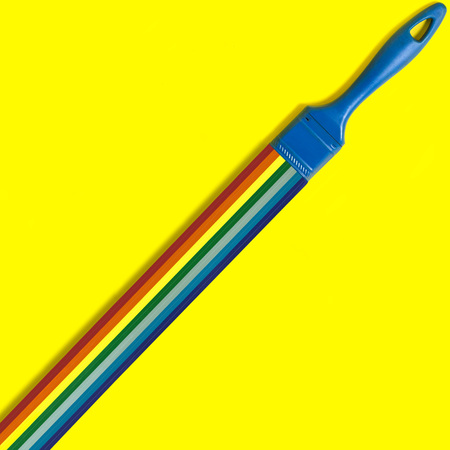 Brush with swirling rainbow strips for quilling.