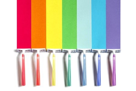 Seven multi-colored razors leave stripes of rainbow colors on paper. Minimal style. Creative idea, imagination and fantasy. Original color conceptの写真素材
