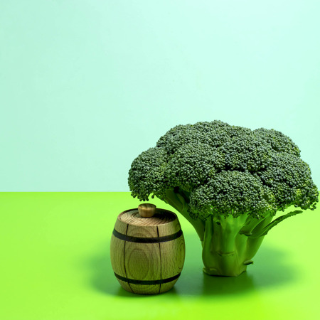 Broccoli as tree and barrel on two-color backgroundの写真素材