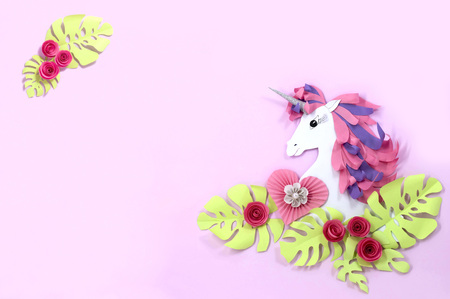 Colorful unicorn and flowers made of paper. Unicorn - symbol of magic, fulfillment of dreams. Paper art and paper craft. Invitation or holiday card for Valentine's Day, birthday and other holidaysの写真素材