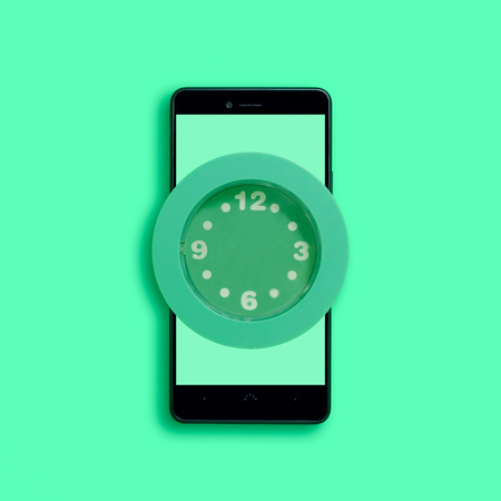 Watch without arrows on smartphone. Symbol of wasted time. Concept of loss of time in social...