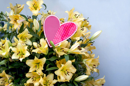 Large luxurious bouquet yellow lilies and heart. Gift on Valentine's day gift, Women's Day, Mother's Dayの写真素材