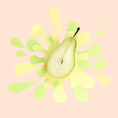 Half juicy pear on paper napkin in form of splash and spray. Delicious juicy fruits. Creative minimal food conceptの写真素材