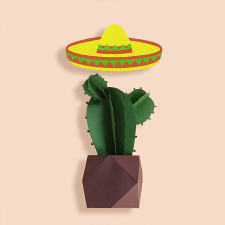 Symbols of Cinco de Mayo sombrero and cactus made of paper. Cinco de Mayo is federal holiday in Mexico on May 5th. Paper art and craft. Minimal holiday concept. Space for textの写真素材