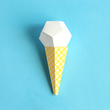 Ice cream in waffle cone made of paper. Volumetric handmade paper objects. Paper art and craft. Trendy hobby. Minimal artistic food concept. Copy spaceの写真素材