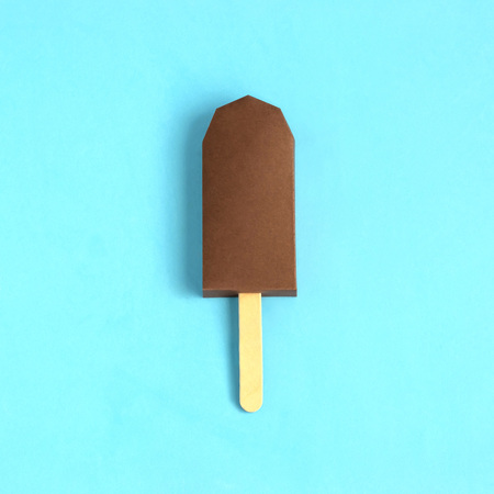 Chocolate ice cream made of paper. Volumetric handmade paper objects. Paper art and craft. Trendy hobby. Minimal artistic food concept. Copy spaceの写真素材