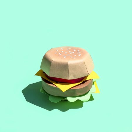 Hamburger made of paper. Volumetric handmade paper objects. Paper art and craft. Trendy hobby. Minimal artistic food concept. Copy spaceの写真素材