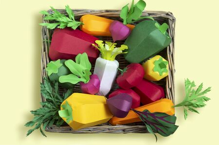 Colorful set of paper vegetables in tray wicker from paper tubes. Paper art and craft. Trendy hobby. Creative, vegetarian, healthy or food art conceptの写真素材