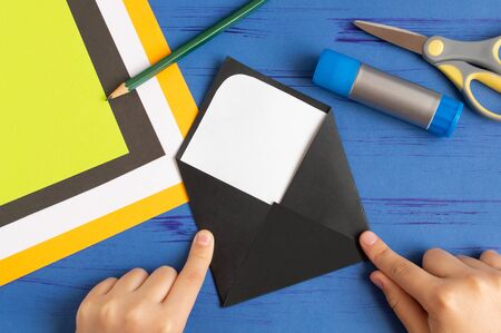 How to make original envelopes for Halloween greetings. Children's art project. DIY concept. Step-by-step photo instruction. Step 4. Make envelopeの写真素材