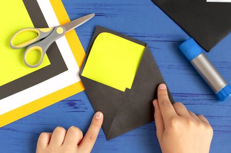 How to make original envelopes for Halloween greetings. Children's art project. DIY concept. Step-by-step photo instruction. Step 8. Make envelopeの写真素材