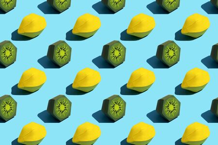 Background of paper lemon and kiwi. Seamless summer food background. Colorful pattern. Volumetric handmade paper objects. Modern paper art and craftの写真素材