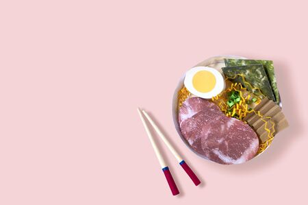Ramen soup and chopsticks made of paper. Food popular in Asian countries. Volumetric handmade paper objects. Paper art and craft. Trendy hobby. Minimal art food concept. Copy spaceの写真素材