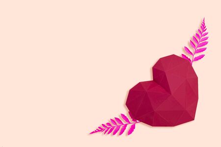 Polygonal paper heart with leaves like wings. Creative layout for Valentine's Day. Paper art and craft in holiday design. Volumetric handmade paper objectの写真素材