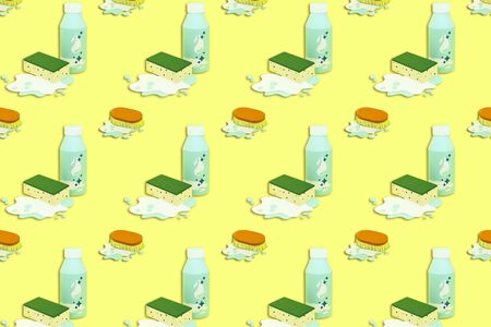 Bright background with paper bottles with detergent and cleaning brushes. Real voluminous handmade paper objects. Minimal art cleaning service conceptの写真素材