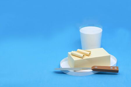 Paper butter on plate and milk in glass. Dairy products. Real volumetric handmade paper objects....