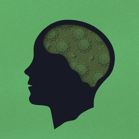 Stylized silhouette of head. Paper models of coronavirus in brain as symbol of nosophobia. Pandemic covid-19. Growth of panic and mental disorders and diseases. Mental health and disease conceptの写真素材