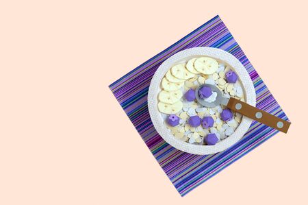 Oatmeal with blueberries and banana in bowl is made of paper. Vegan breakfast. Food for healthy diet. Real volumetric handmade paper objects. Paper craft and art. Minimal art food concept. Copy spaceの写真素材