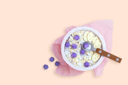 Oatmeal with blueberries and banana in bowl is made of paper. Vegan breakfast. Food for healthy diet. Real volumetric handmade paper objects. Paper craft and art. Minimal art food concept. Copy spaceの写真素材