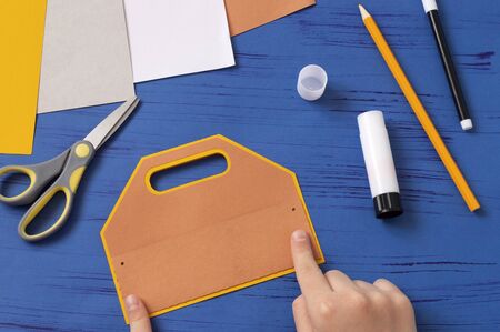 Child makes card for Father's Day. Children's craft during quarantine. How to captivate children at...