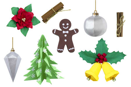 Set of paper Christmas and New Year decor isolated on white background. Paper art and craft. Handmade real paper objects. Paper Christmas tree, toys, poinsettia, bells, gingerbread man, cinnamonの写真素材