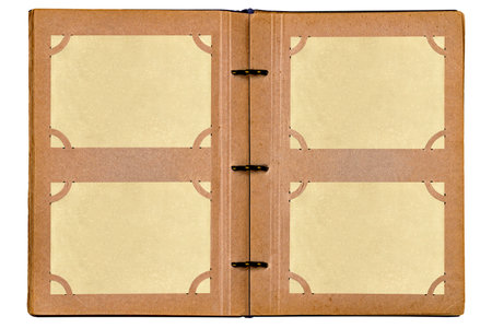 Open old photo album isolated on white background. Album pages with empty yellowed photo paper stuck in photo slots. Mockup for vintage designの写真素材