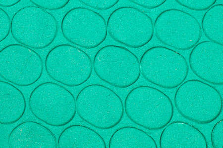 Green kinetic sand texture for children's play and sculpting with oval prints. Abstract backgroundの写真素材