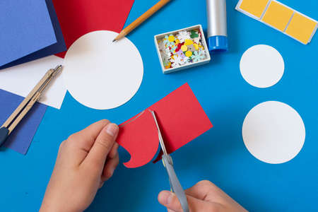 Making Christmas card with voluminous snowman. Original project for children. DIY concept. Step-by-step photo instructions. Step 6. Cut snowman hatの写真素材