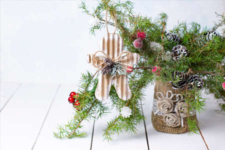 Vintage decorations for handmade Christmas bouquet. Corrugated cardboard little man. Burlap decor for vase. Eco-friendly natural decorationsの写真素材