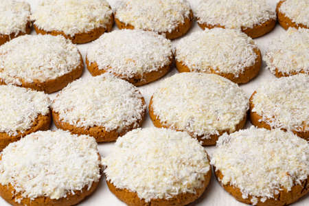 Lots of cookies with white chocolate and coconut. Food background and texture of coconut cookiesの写真素材