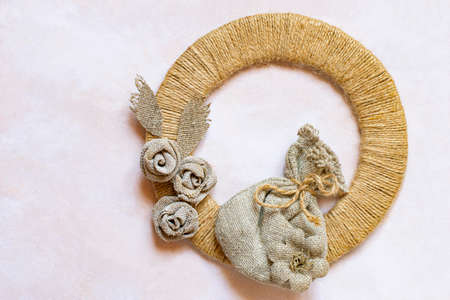 Natural materials jute thread and burlap in eco-decor. Jute ring embellished with handmade burlap flowers and burlap pouch. Eco-friendly natural materials for handicraftの写真素材