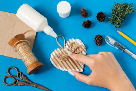 Making vintage decoration from packing cardboard for Christmas decor. Eco-friendly handmade decoration. Reuse, zero waste. DIY concept. Step by step photo instructions. Step 7. Glue jute bowの写真素材